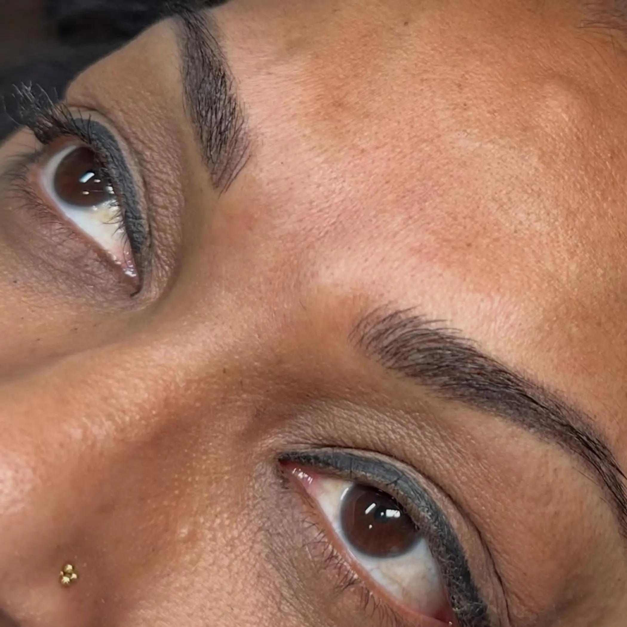 cosmetic tattoo artist performing procedure