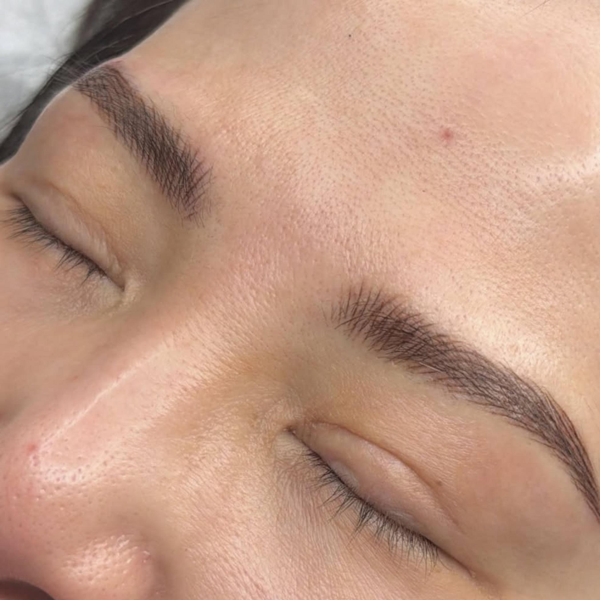 technician applying powder brows procedure